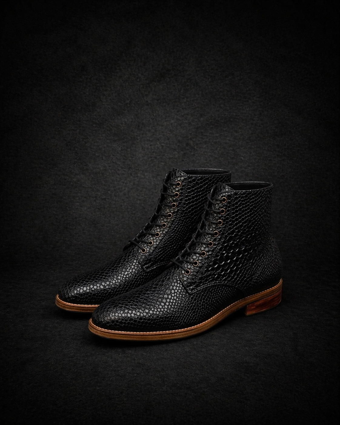 Pair of black textured boots on a dark background FOSSIL Dragon Tail Black Lace-Up Leather Dress Boot for Men - Kyoto Boots 
