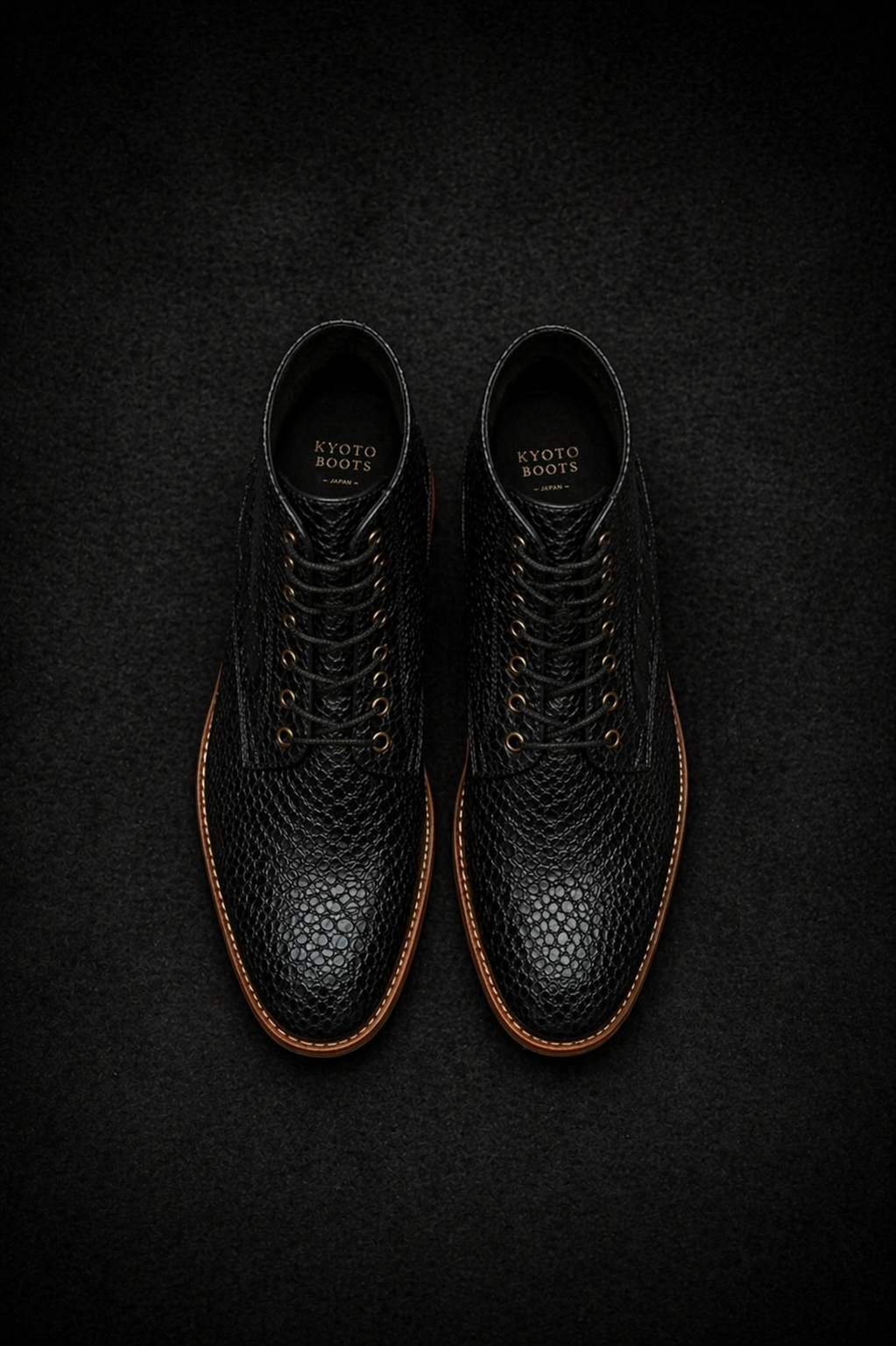 Pair of black leather boots on a dark textured background FOSSIL Dragon Tail Black Lace-Up Leather Dress Boot for Men - Kyoto Boots